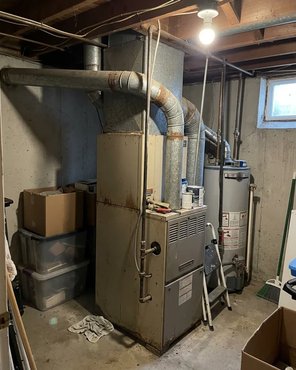 25-year-old gas furnace in a Toronto basement before conversion