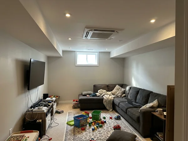 Ceiling cassette head flush in a finished basement ceiling