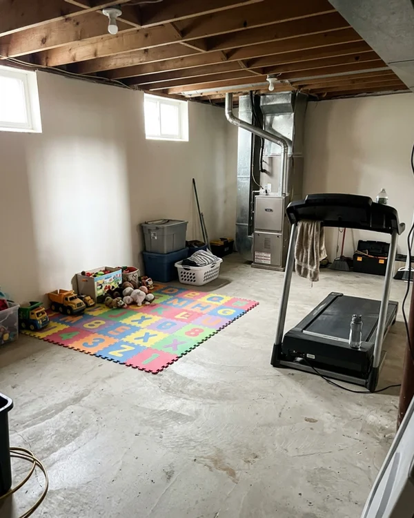 Clean mechanical room with a compact heat pump air handler installed