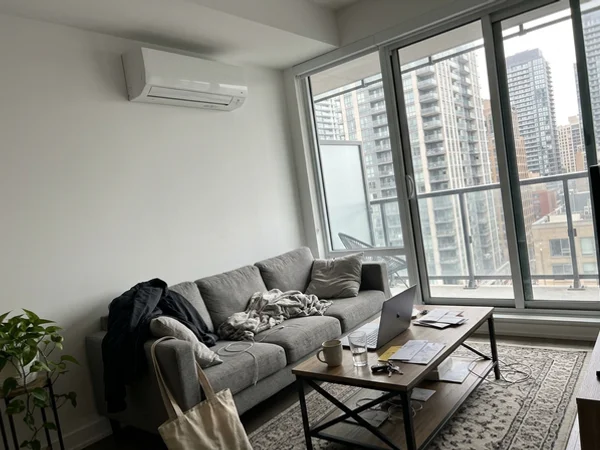 Fujitsu wall-mounted heat pump in a Yorkville condo living room