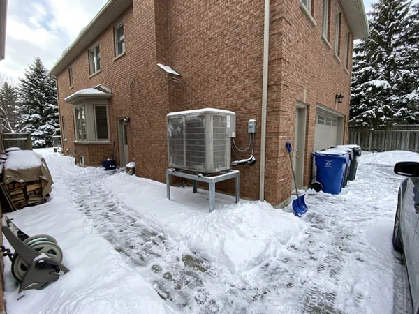 Mitsubishi Hyper-Heat 4-ton outdoor unit on a raised stand in Forest Hill