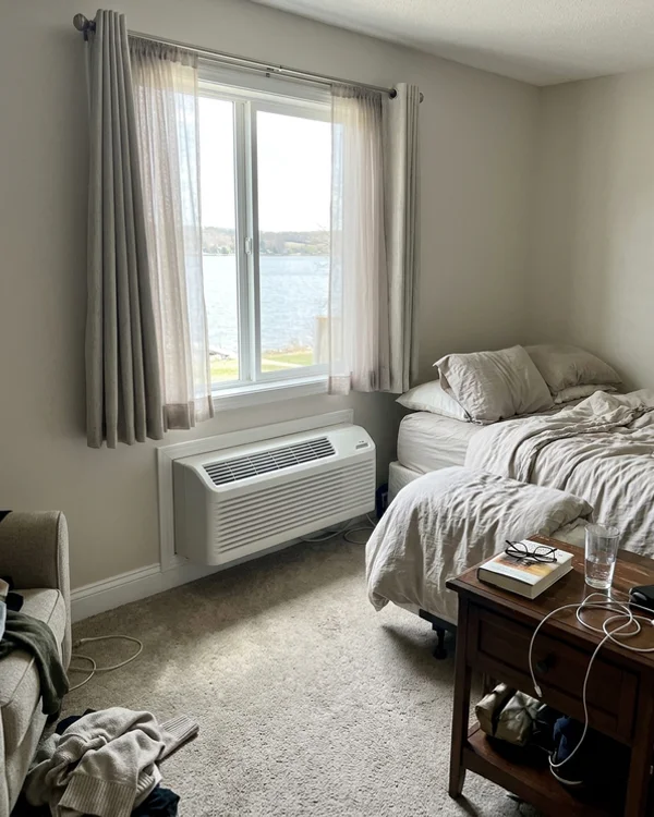 New quiet heat pump PTAC under the same condo window
