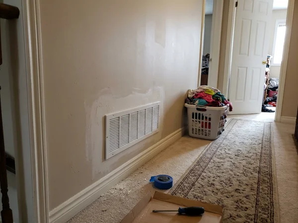New second-floor return air grille in a Markham hallway