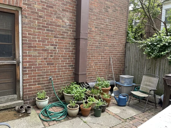 Three Mitsubishi heat pump line sets running into a common mechanical area of an apartment building